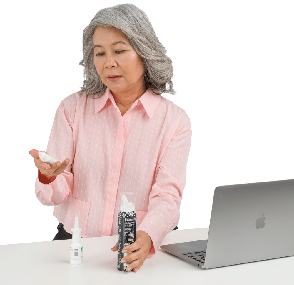 woman holding nasal spray